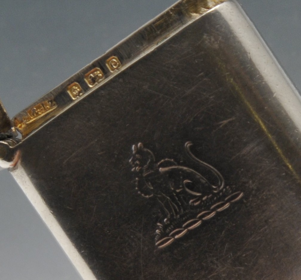 An Edwardian silver vesta case of plain oblong form with engraved family crest to the front, - Image 2 of 7