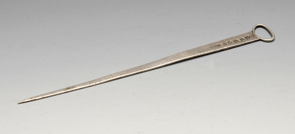 A George III silver meat skewer, of plain tapering form leading to the suspension ring terminal.