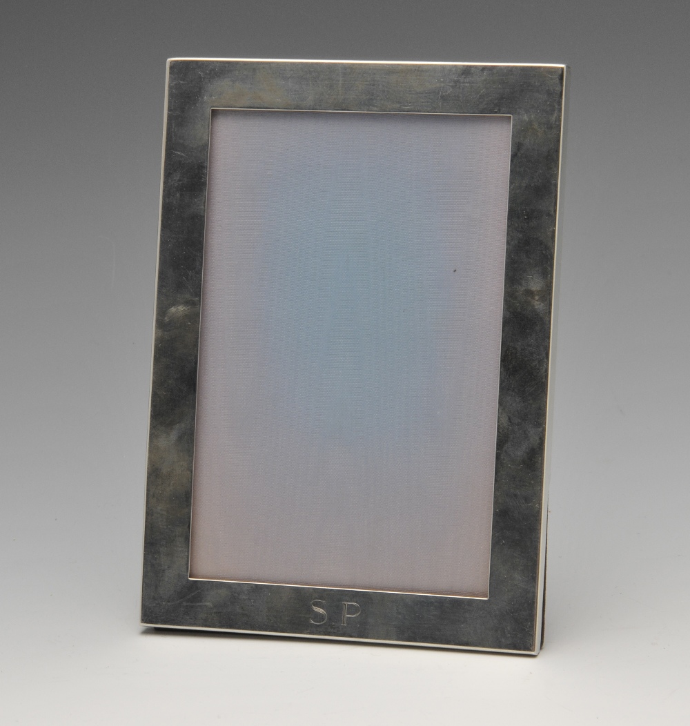 A Tiffany & Co. silver mounted photograph frame, of rectangular form having engraved personal