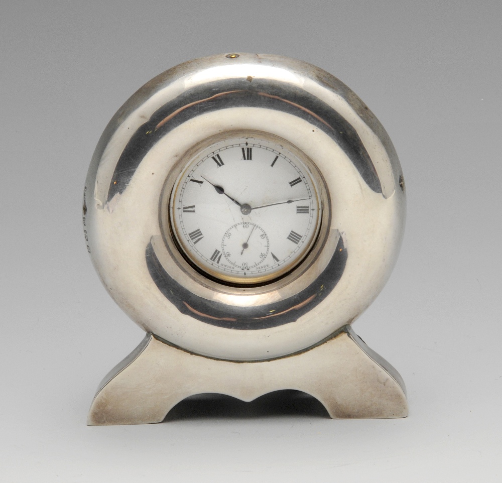 An Edwardian silver mounted pocket watch stand, of circular outline having easel support verso,