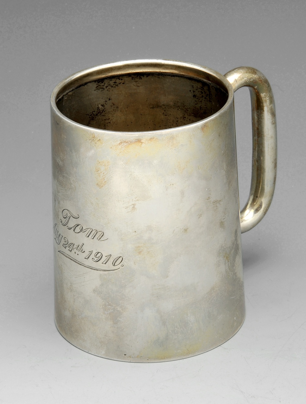 An Edwardian silver christening mug of plain and slightly tapering form, with personal engraving and