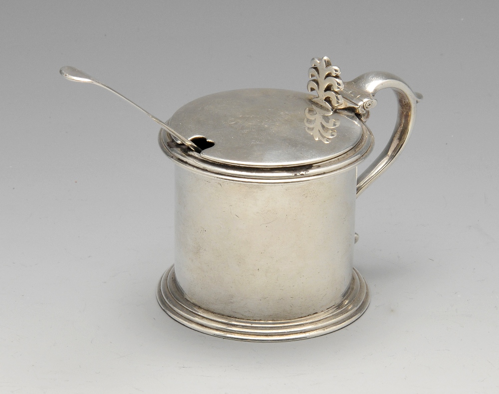 A Victorian silver drum mustard pot, the plain cylindrical form with crested hinged cover, scroll