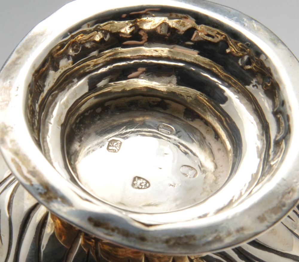 A George III silver cream jug, the bellied form with oblique and floral embossing and sparrow - Image 2 of 12