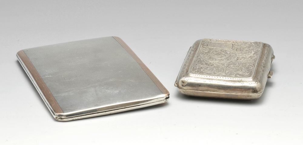 A 1920's silver cigarette case of rounded rectangular form, having foliate scroll engraving