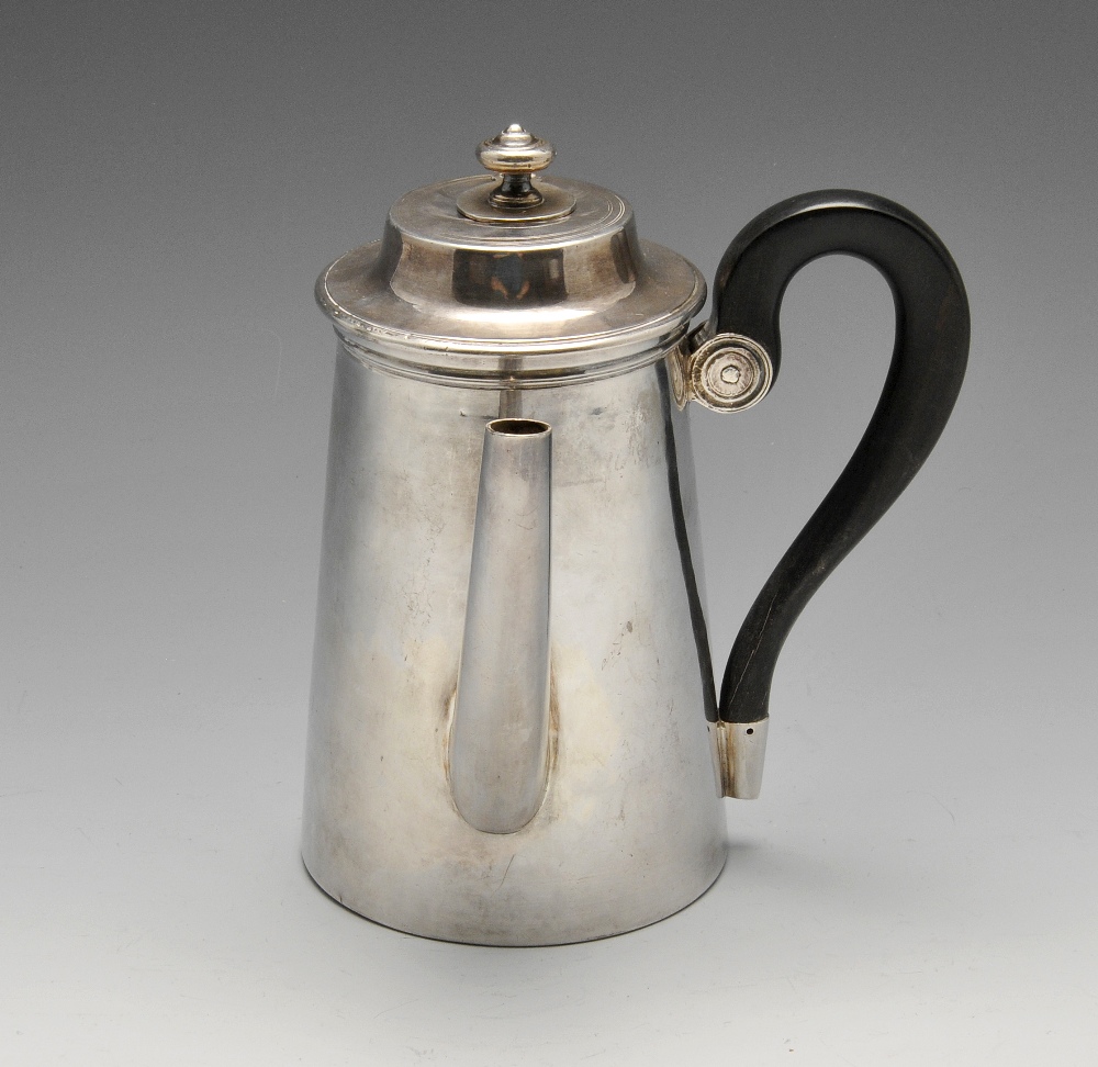 A late eighteenth century/early nineteenth century French silver chocolate pot, the plain tapered