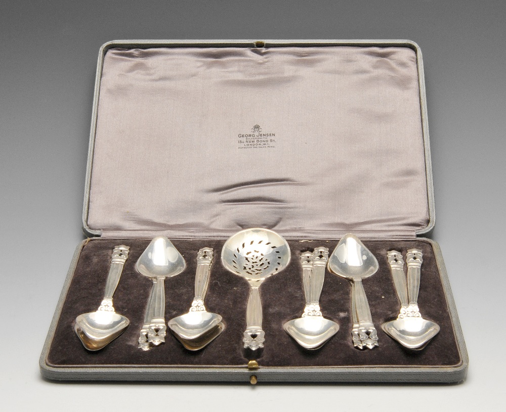 A 1920's set of twelve Acorn pattern silver grapefruit spoons by Georg Jenson complete with