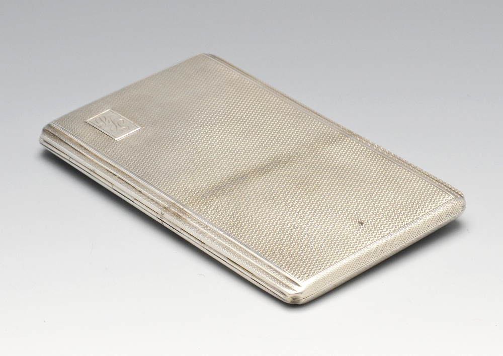A mid-twentieth century silver cigarette case of rounded rectangular form, having stepped sides,