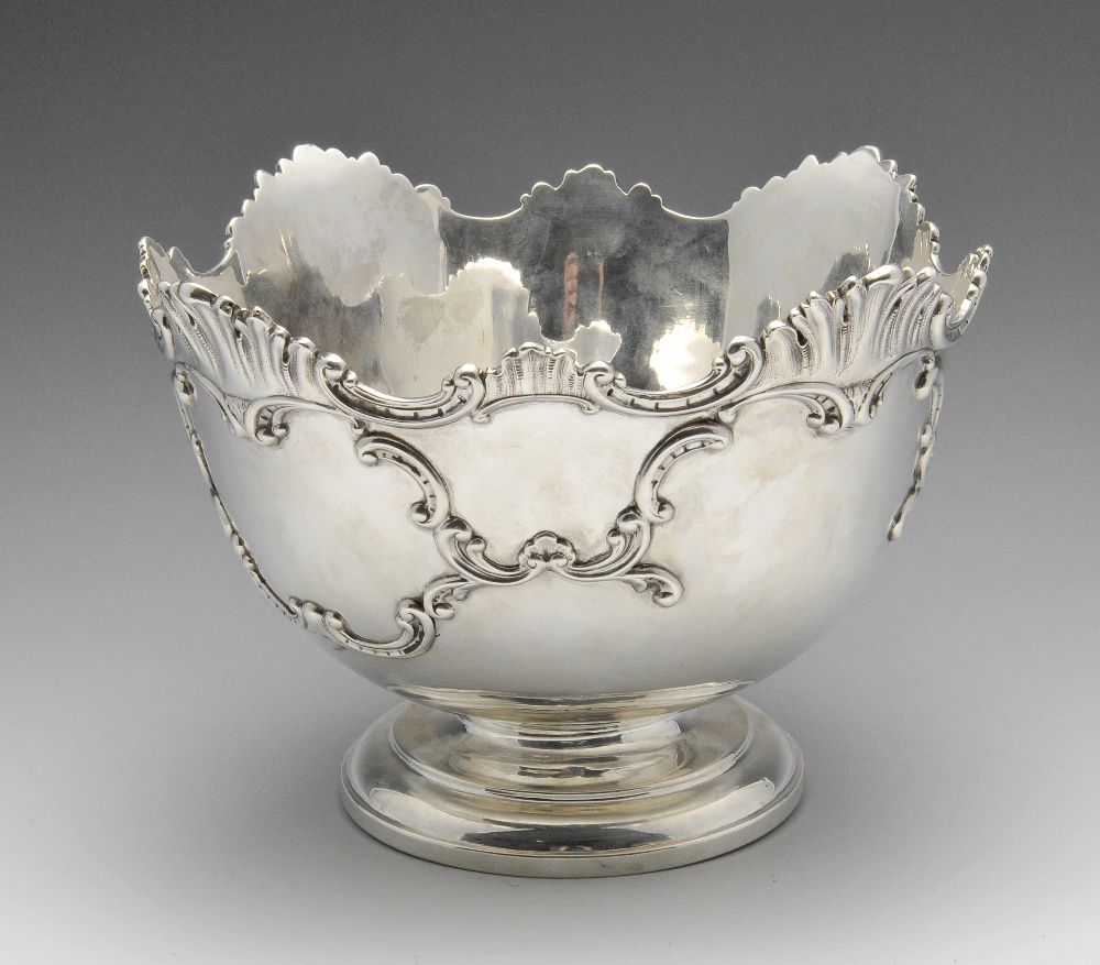 A large late Victorian silver rose bowl, the circular form with applied scroll-work and shaped shell