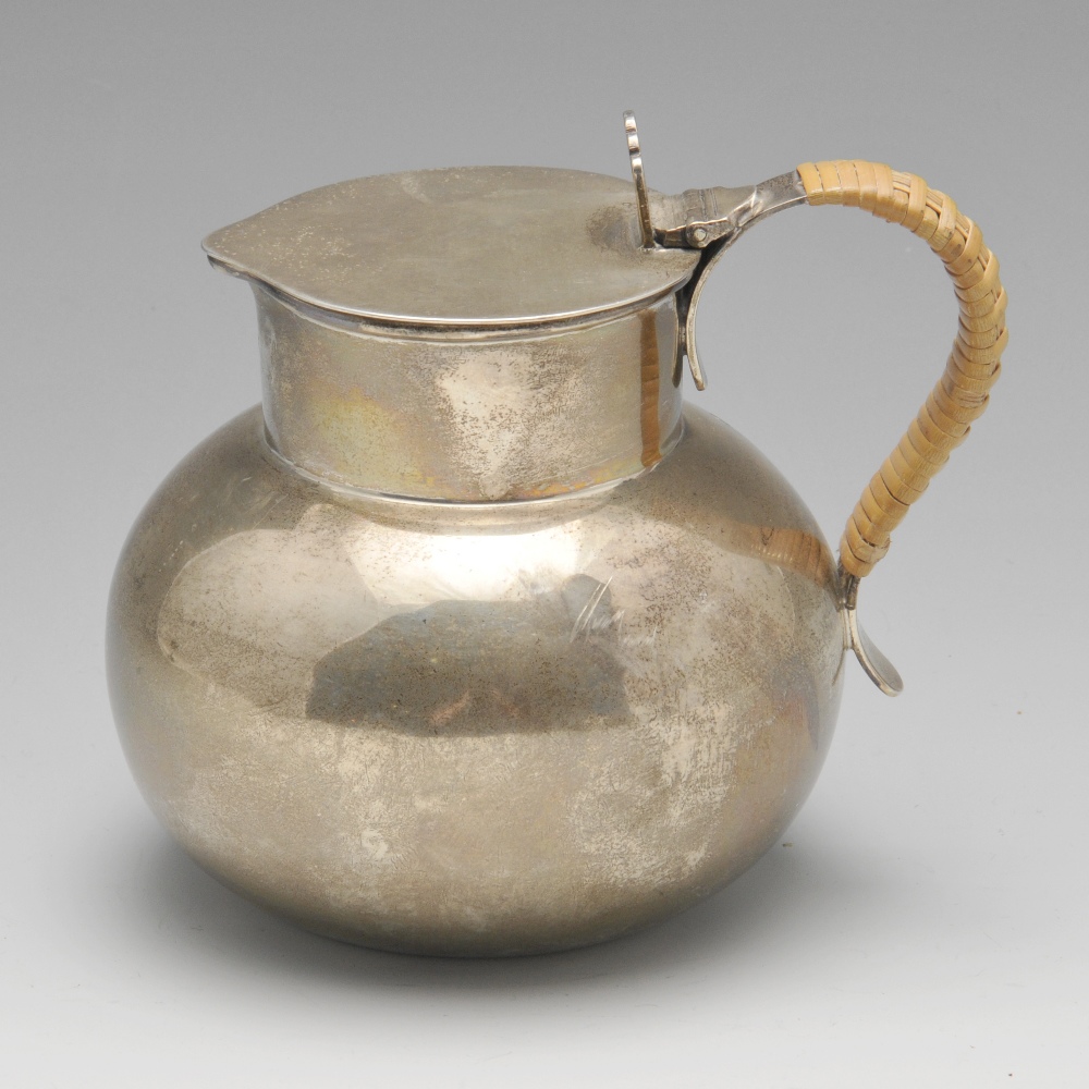 A 1930's silver hot milk jug, of plain globular form with short cylindrical neck and woven handle.