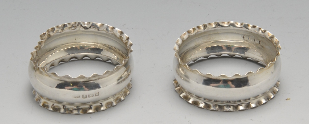 A set of five late Victorian silver napkin rings having frilled rims, hallmarked Birmingham 1897, - Image 3 of 4