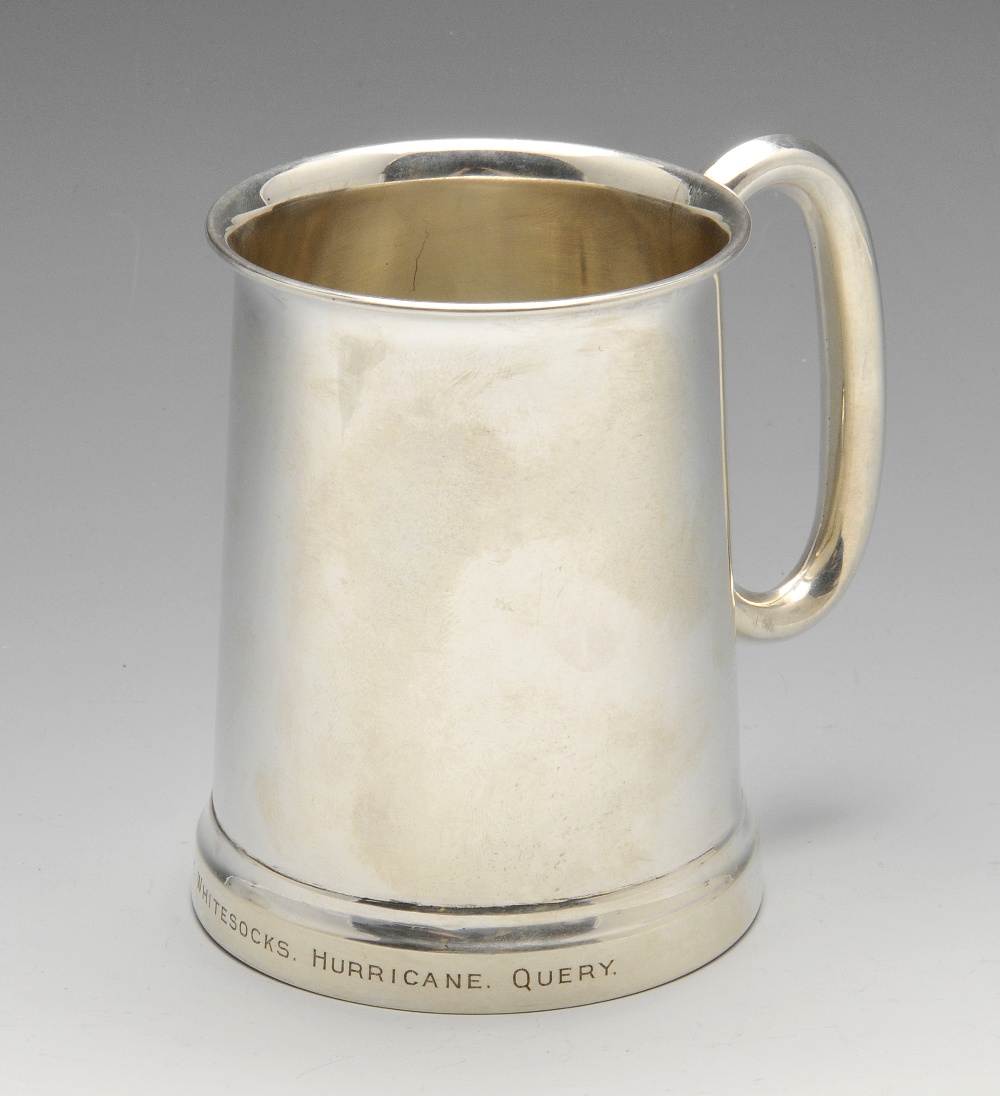 A 1950's silver mug of plain tapering form, 'C' shaped handle, personal inscription to the bottom