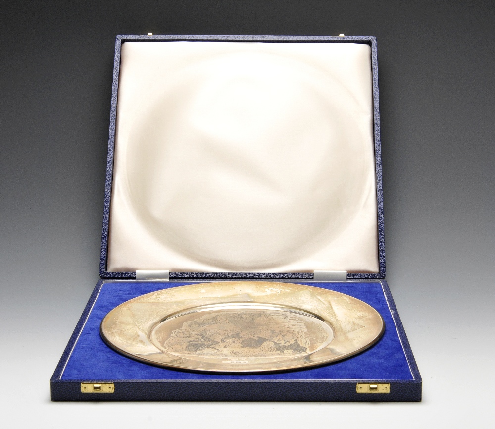 A cased 1970's limited edition silver dish, of plain circular form having central Pickwick Christmas