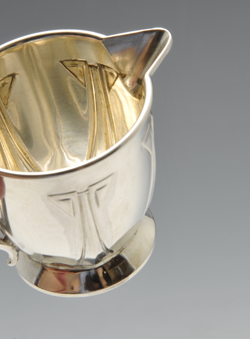 A pair of small German silver cream jugs with embossed panelled decoration, German assay marks for - Image 3 of 9