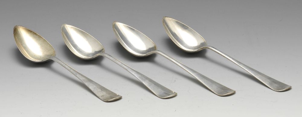 A set of four Dutch silver table spoons, the reverse terminals with monogram engravings. Together