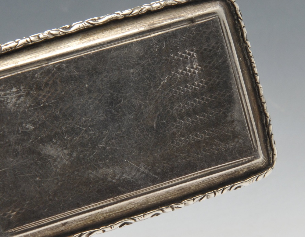 An early Victorian silver snuff box, the rounded rectangular form with floral scroll borders - Image 6 of 6