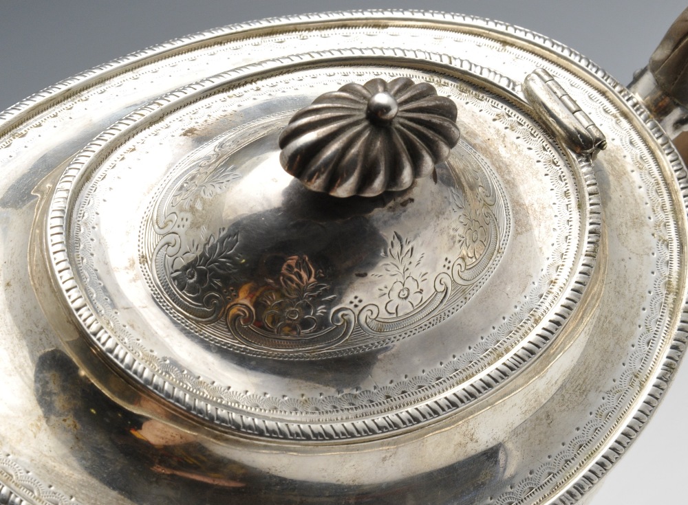 A Victorian silver teapot of oval form, the shaped body embellished with bright-cut floral scroll - Image 3 of 6
