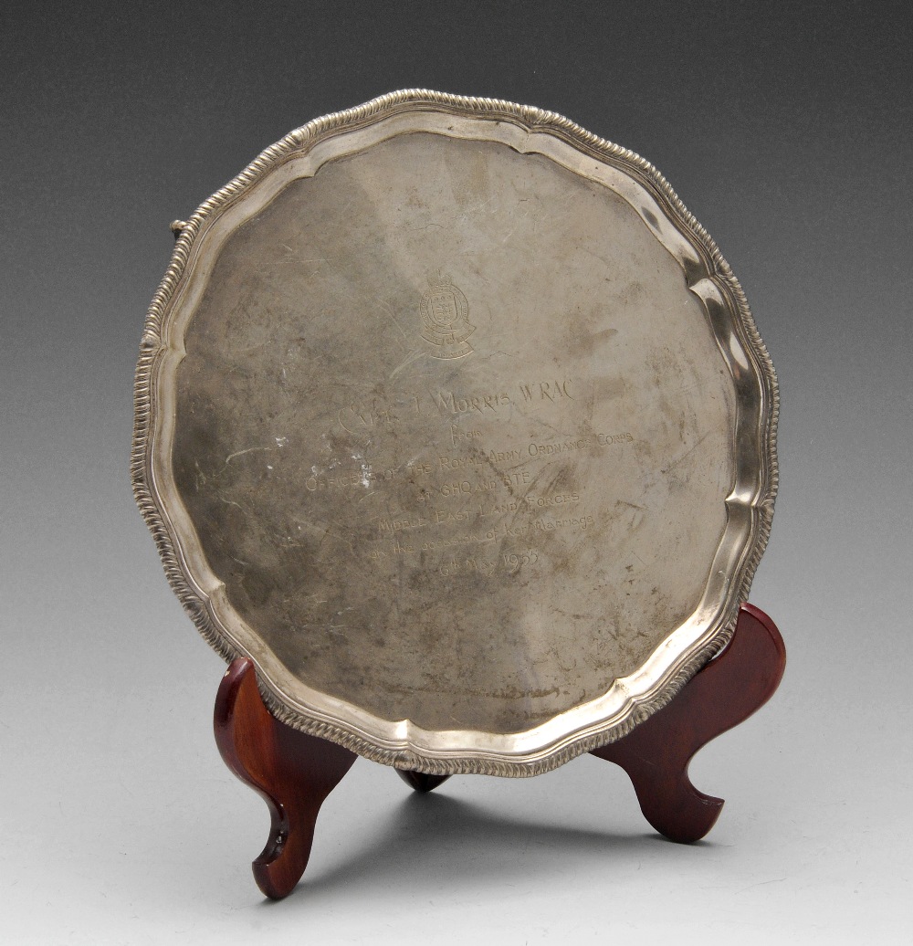 A mid-twentieth century small silver salver, the shaped circular form with oblique gadrooning to