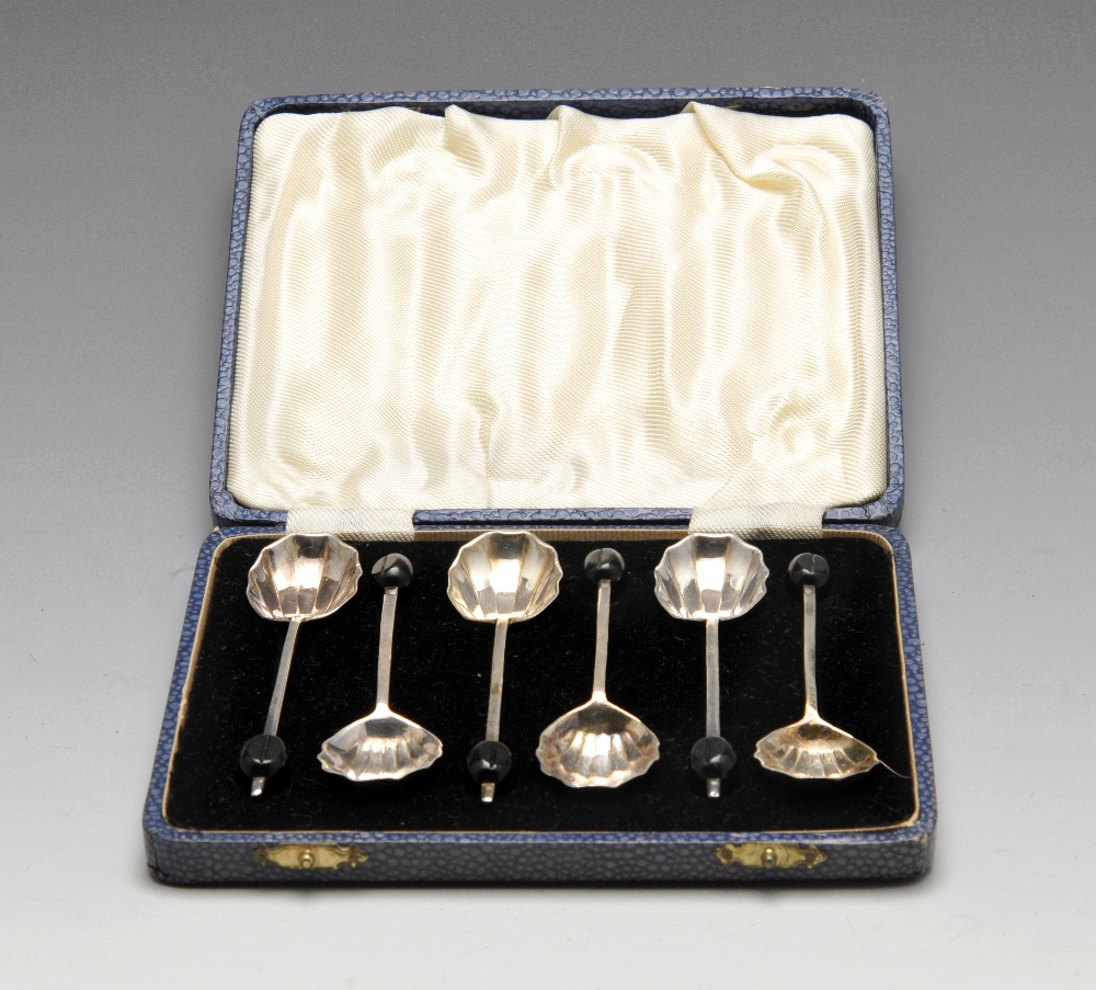 A cased set of six silver plated coffee spoons, each having coffee bean terminal and plain stem