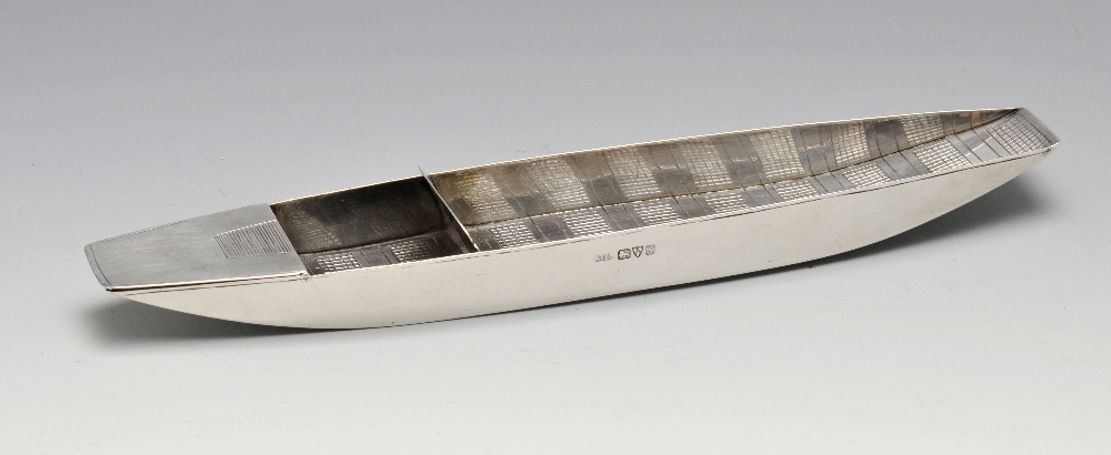 An Edwardian silver novelty desk smoking compendium in the form of a boat, having open