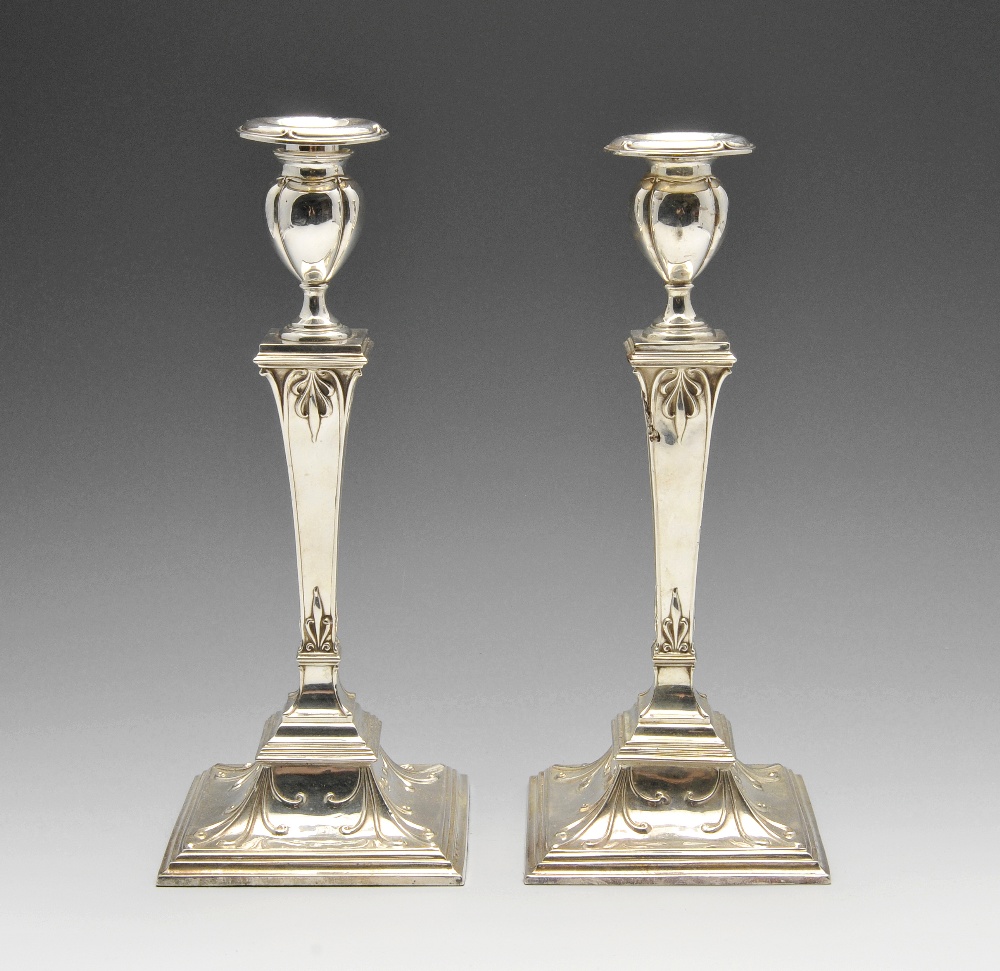 A matched pair of early twentieth century Scottish silver candlesticks, each with a stepped and