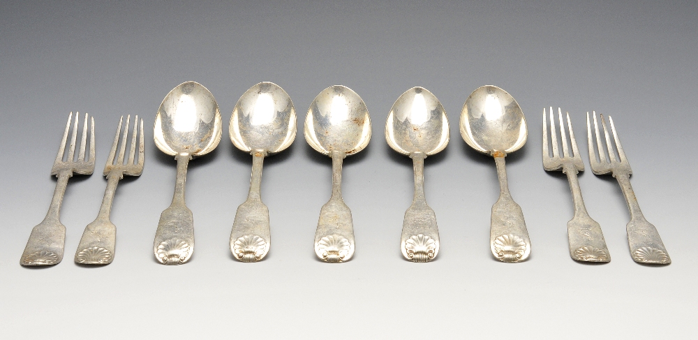 Four Victorian Scottish silver table forks and five table spoons in Fiddle Shell pattern with