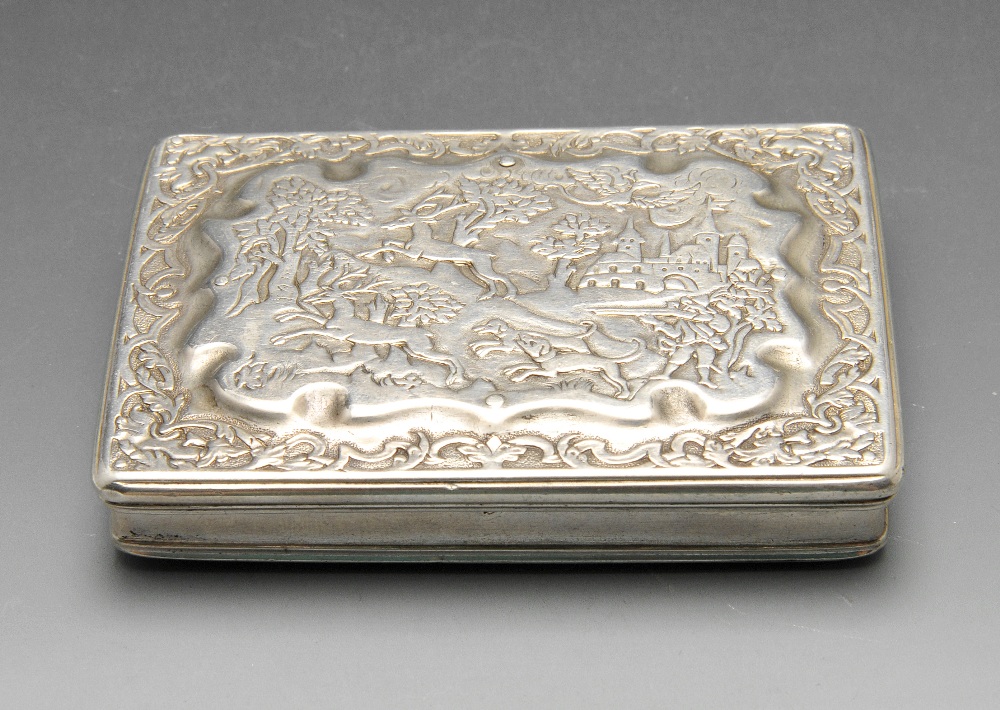 A continental snuff box of rounded rectangular form, the hinged lid with raised panel showing a