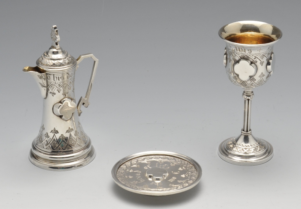 A Victorian silver cased Communion set, comprising a chalice, flagon and paten, each decorated - Image 2 of 9