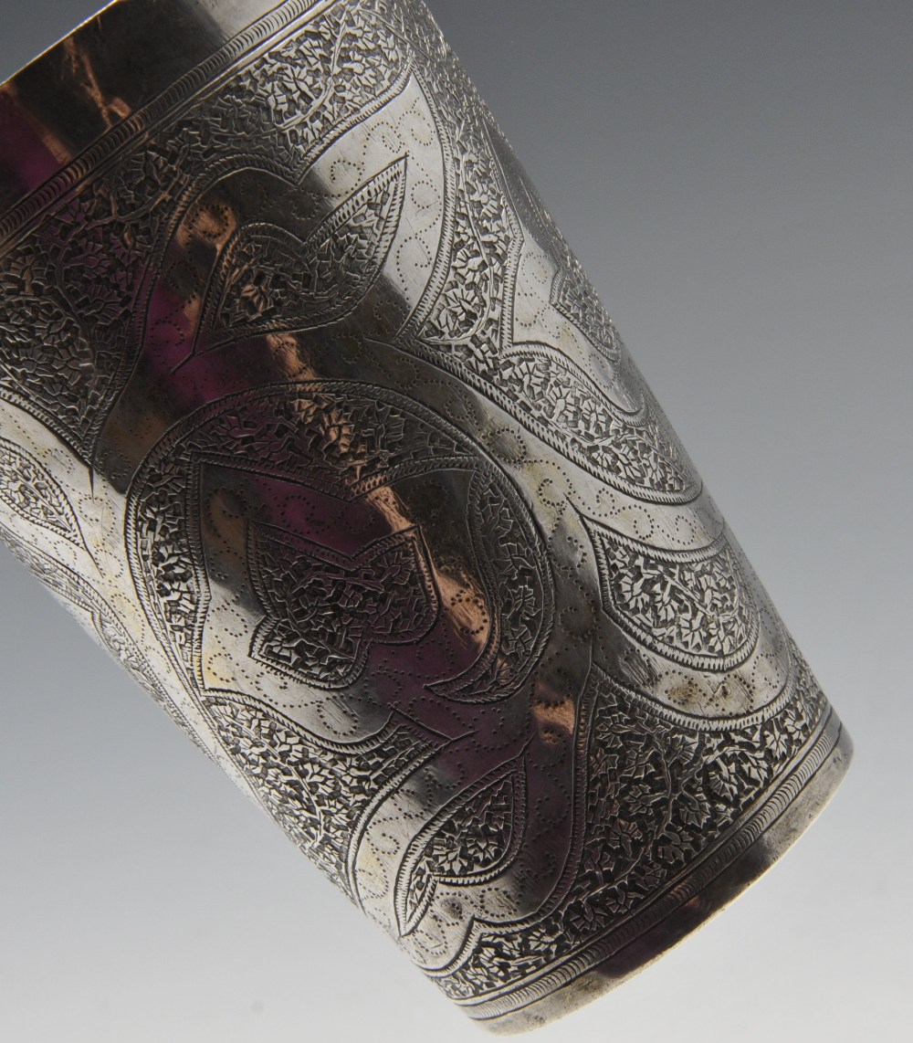 A Persian jug of vase form and ornately close chased with foliate decoration and matching tapered - Image 4 of 4