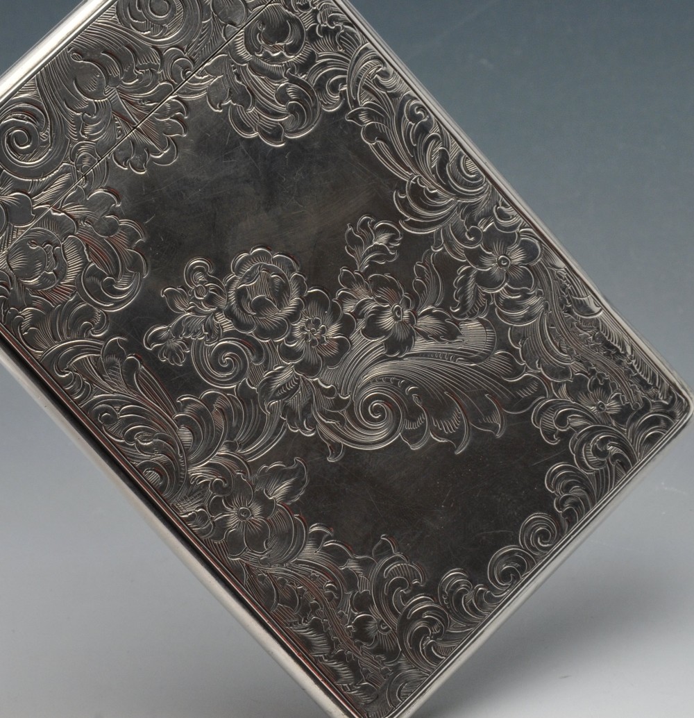 An early Victorian silver card case, the oblong form encased with floral scroll engraving and - Image 4 of 4