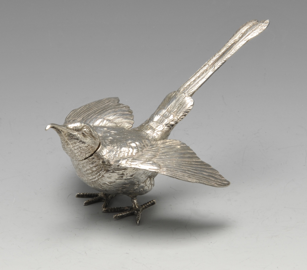 A nineteenth century Dutch silver pepper modelled as a long tailed bird with realistic feather