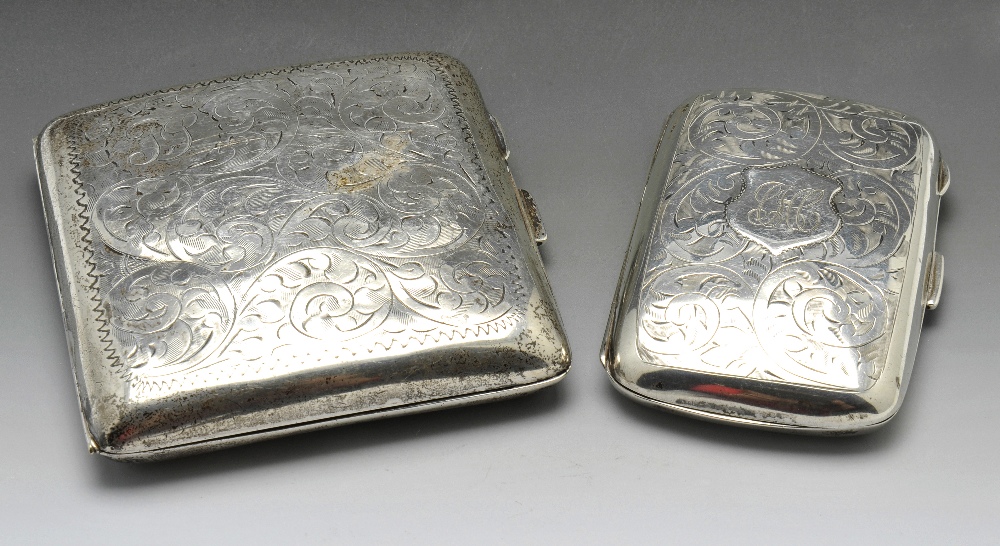 Two 1920's silver cigarette cases, the first of rounded square form with foliate scroll engraving