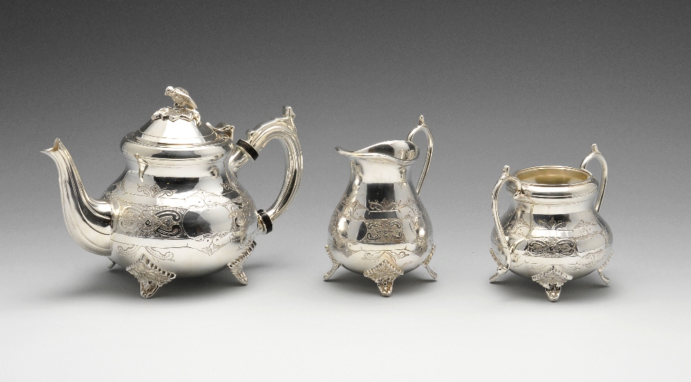 A silver plated Fortnum & Mason three piece tea service comprising a teapot, twin-handled sugar bowl