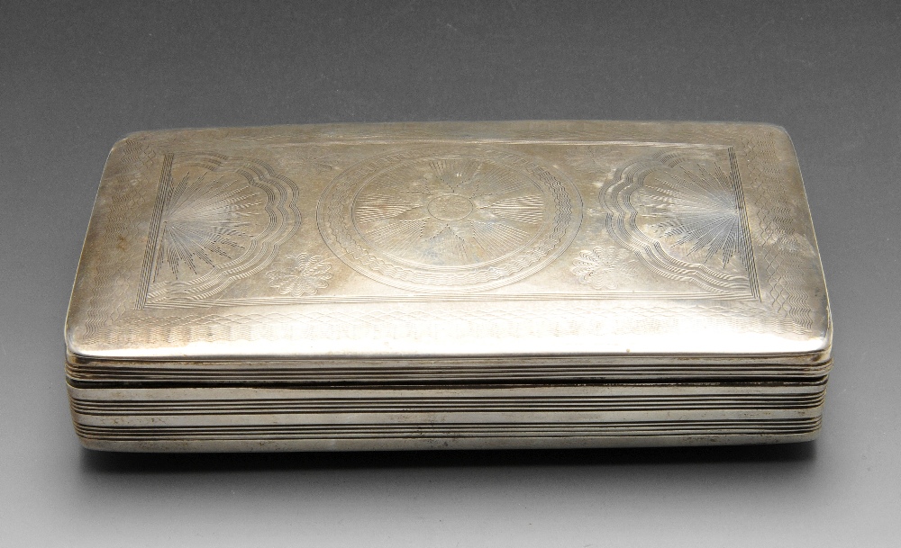 A Dutch silver box, the oblong form with concentric floral motifs within wriggle-work border to