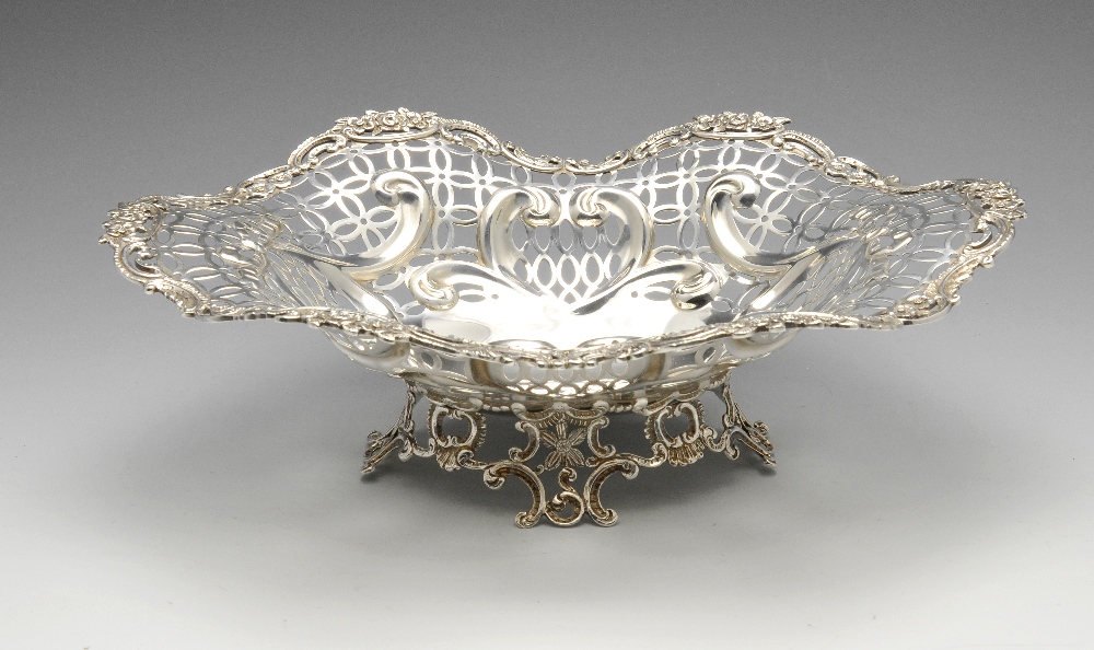 A late Victorian silver basket, of lobed form having foliate rim and wide pierced border detailed