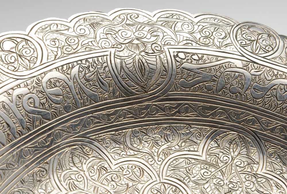 An Egyptian silver plate, the circular form entirely close engraved with intertwining motifs, raised - Image 4 of 4