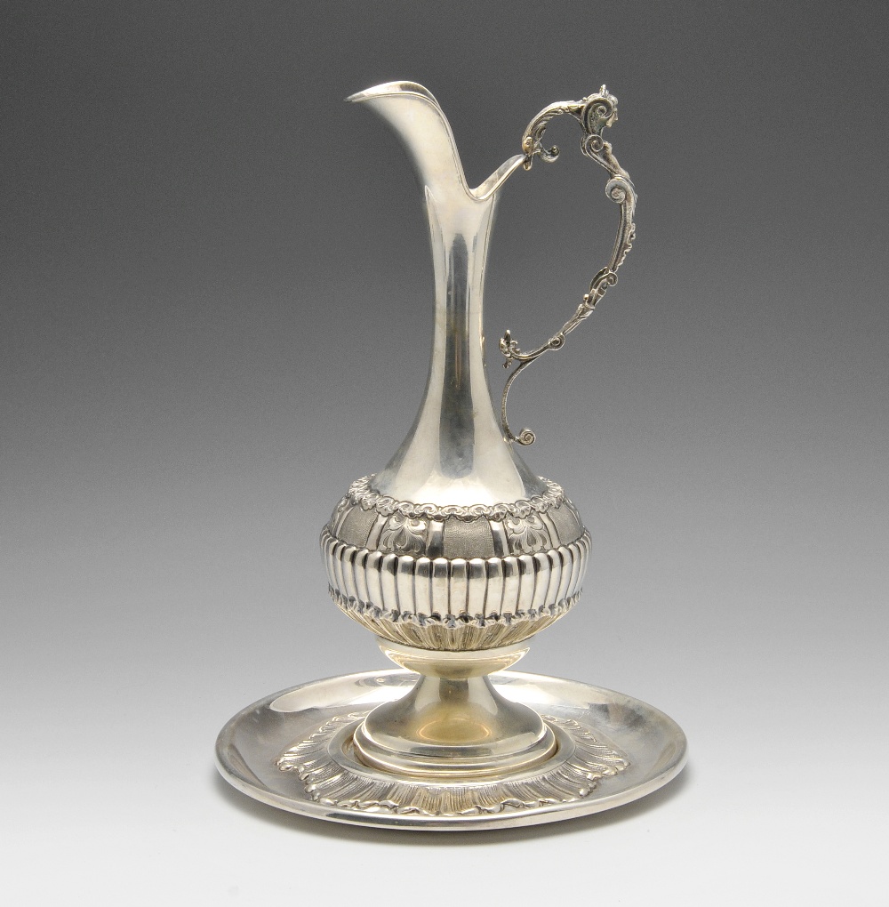 A mid-twentieth century Italian ewer on circular stand, the ewer of bulbous form decorated with
