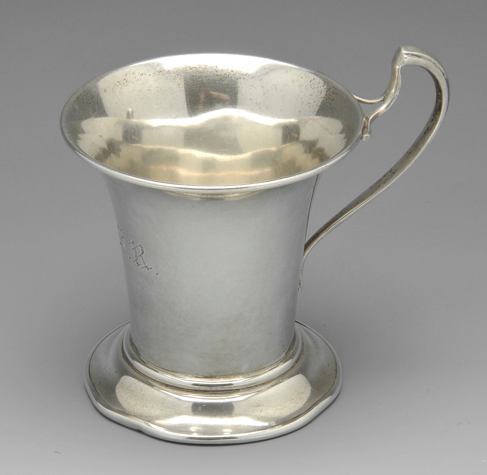 An early twentieth century silver christening mug of tapering form with initial engraving standing