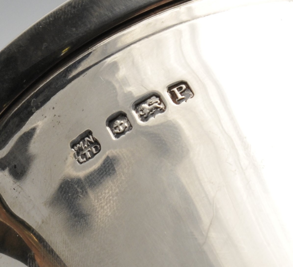 An Art Deco silver mug, of slight tapered form having accented handle raised upon a stepped foot. - Image 2 of 3