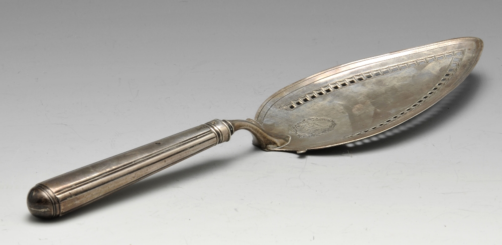 A George III silver fish slice, the oval blade with engraved and pierced border, monogram with