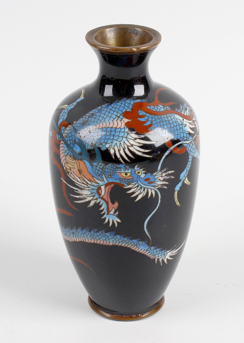 A small cloisonne vase with slender tapered ovoid body finished in a dark blue coloured ground