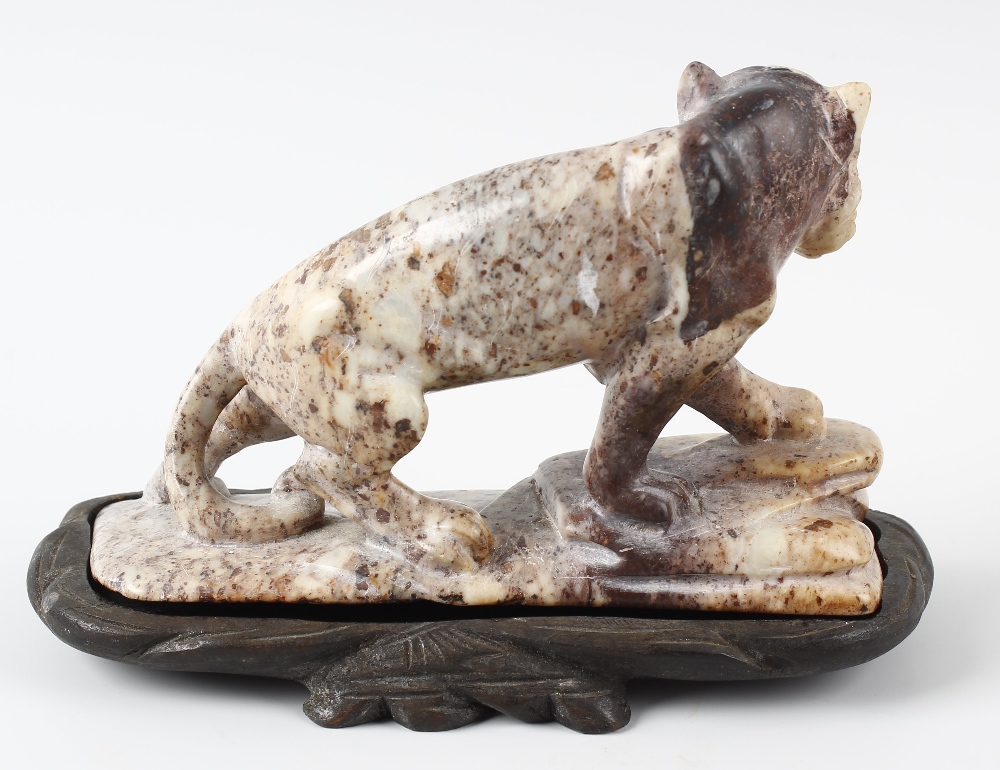 An Eastern hardstone figure of a tiger. Stood in crouched stance with open mouth upon a rocky base - Image 2 of 4