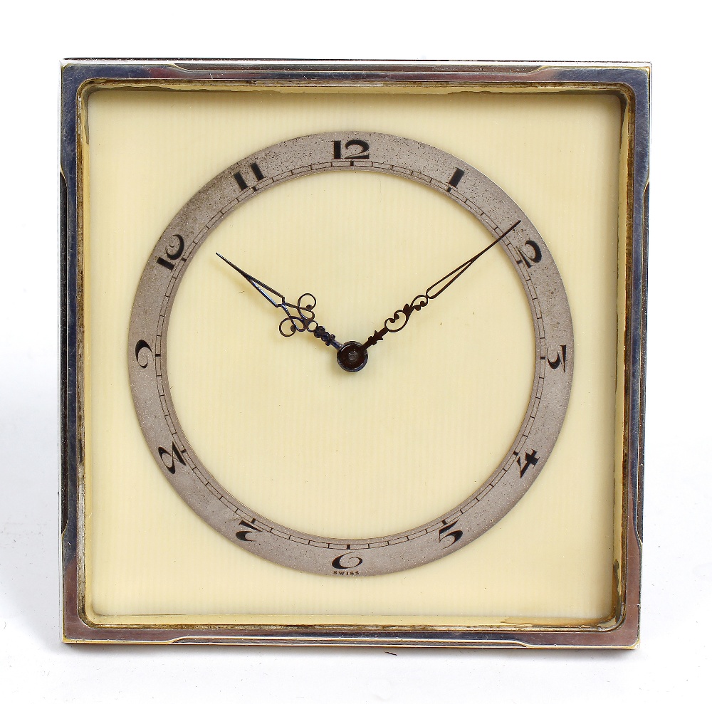 A Swiss Art Deco desk timepiece. The 3-inch Arabic chapter ring and blued steel hands upon a cream