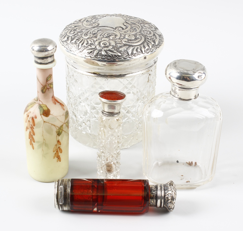 A selection of scent bottles to include a cut glass dressing table jar with Sheffield 1900