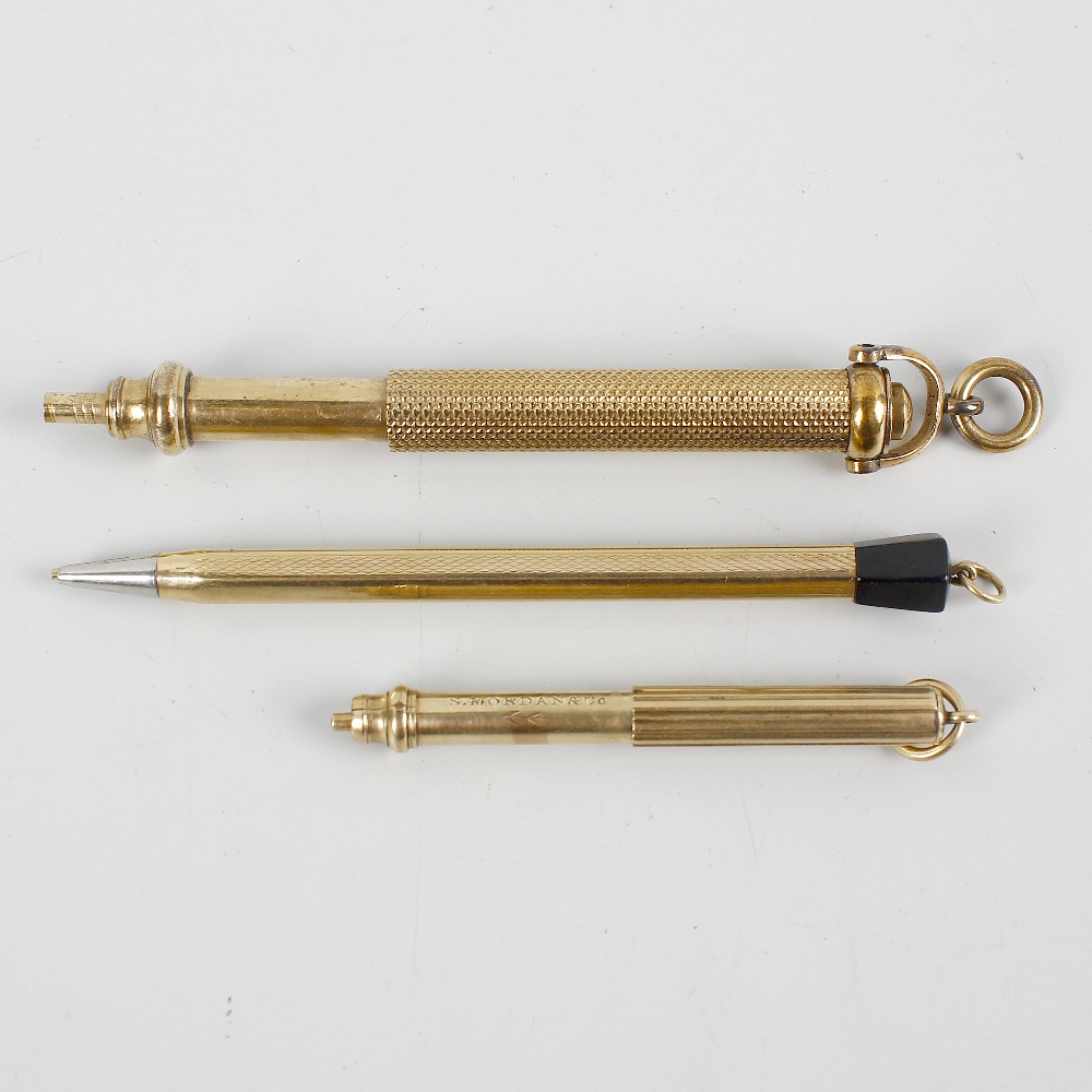 Three yellow metal retractable pencils. Comprising two Sampson Mordan & Co. examples, the larger