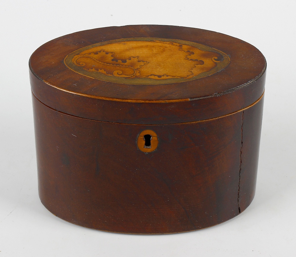 A George III inlaid mahogany oval tea caddy, the hinged cover with harewood and stained lime wood