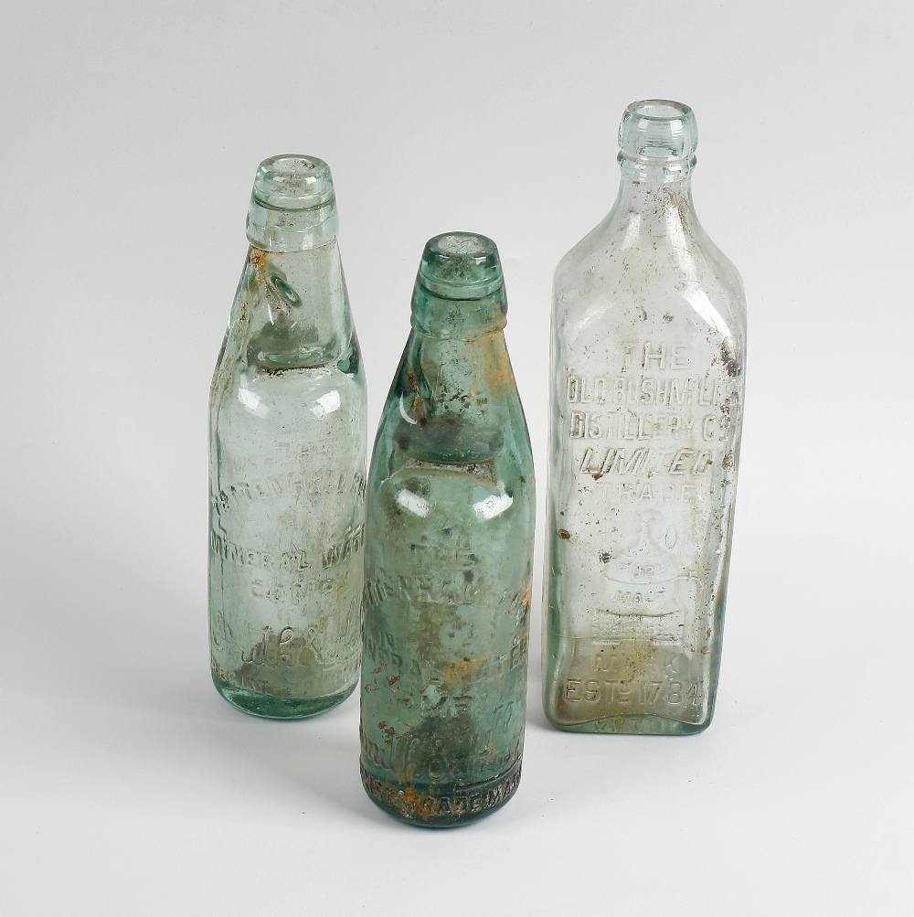 Two boxes containing a collection of assorted glass bottles Comprising a group relating to