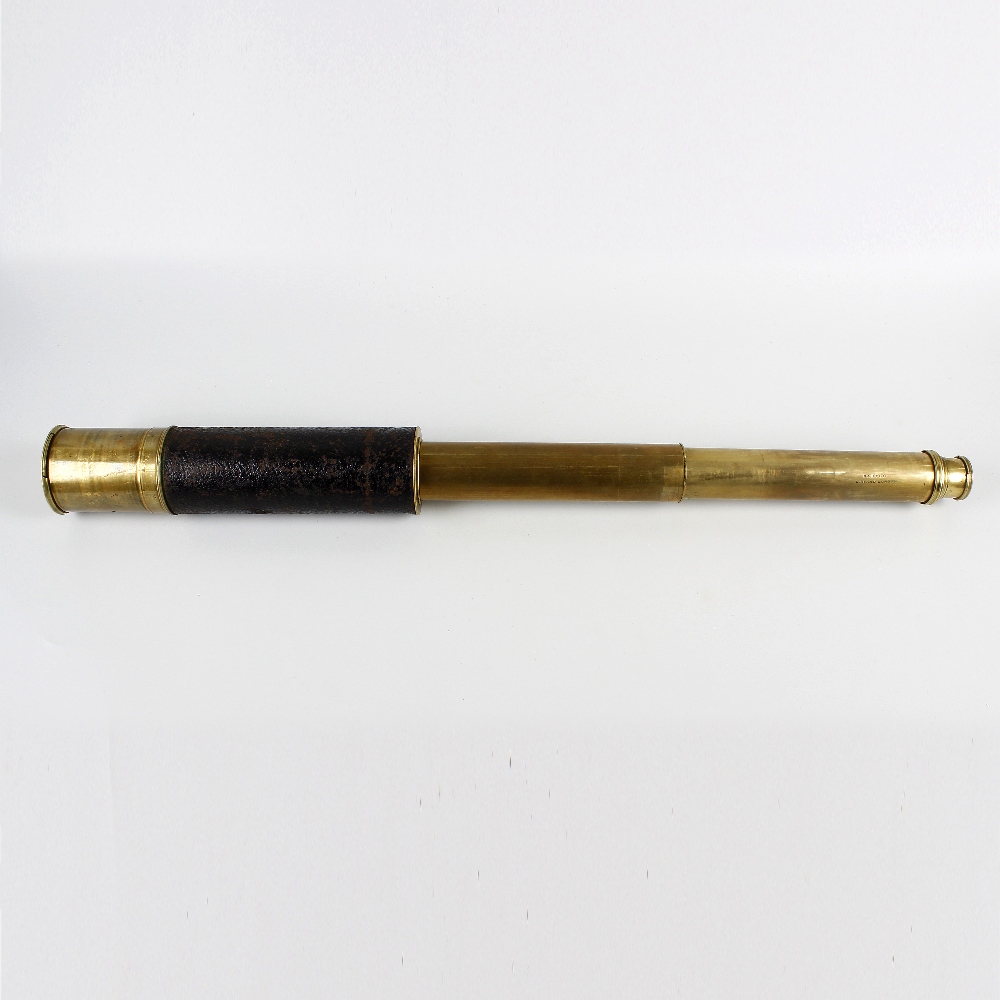 A Victorian brass-bodied three-draw telescope. The black morocco-covered 2.5-inch main barrel with