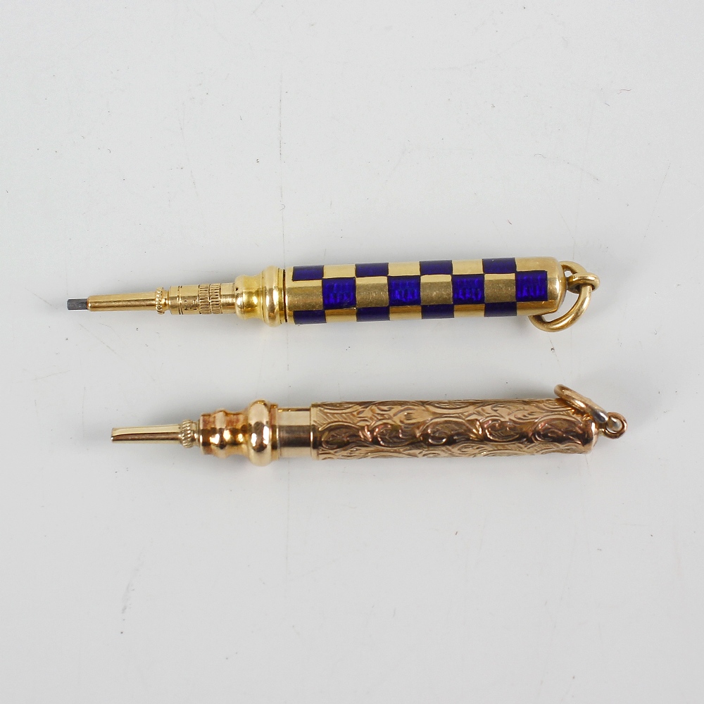 Two yellow metal retractable pencils. The first having enamelled chequered barrel and marked 'M'