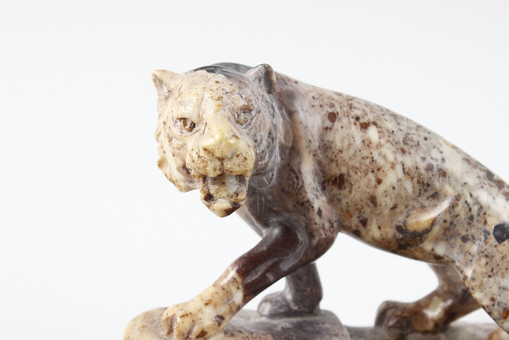An Eastern hardstone figure of a tiger. Stood in crouched stance with open mouth upon a rocky base - Image 3 of 4