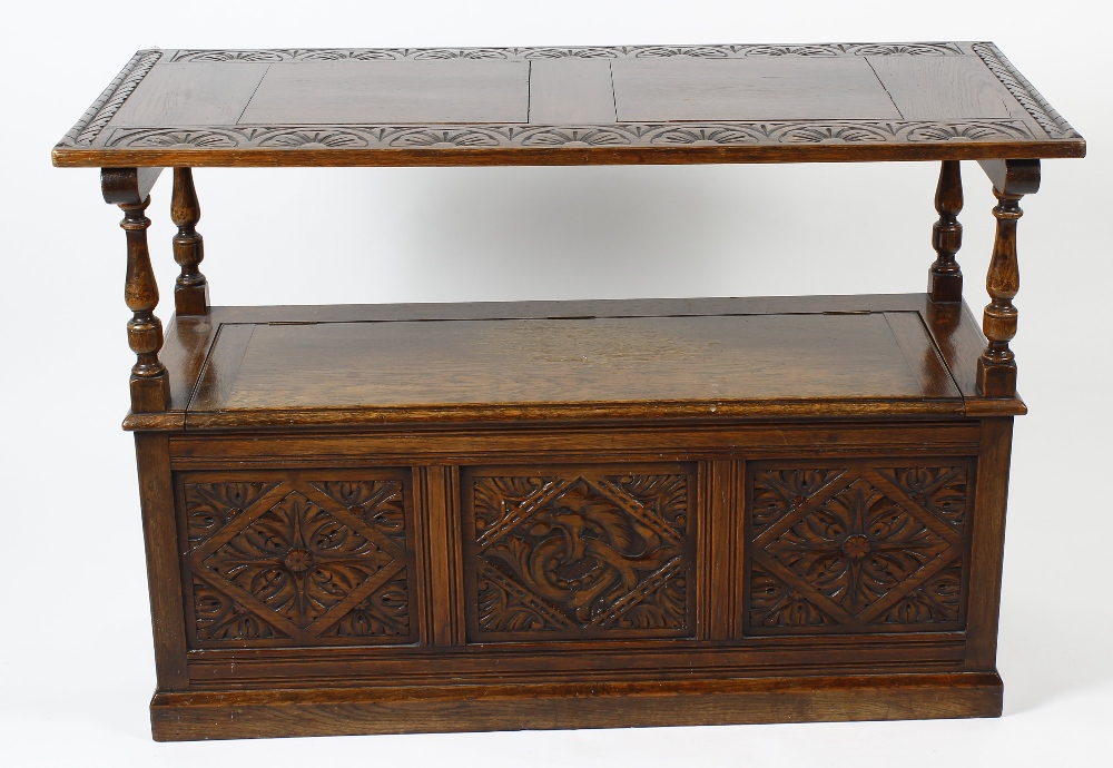 An early 20th century oak 'monk's bench'. Of typical form, the rectangular turn-over top with - Image 3 of 3